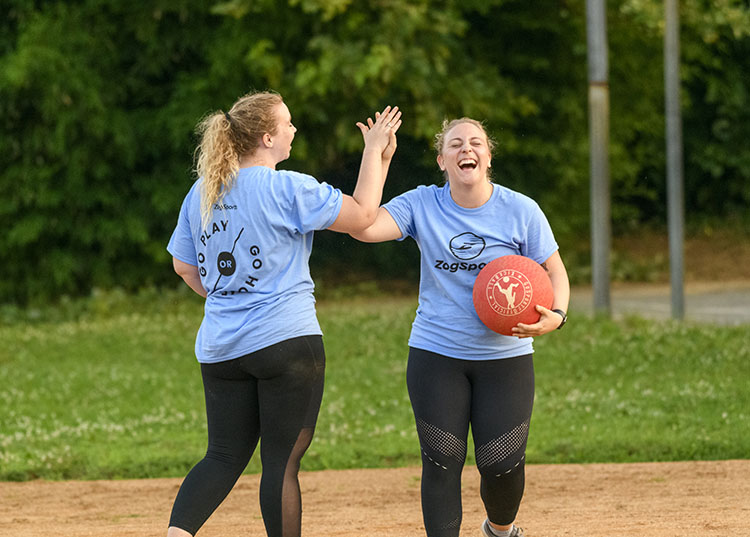 kickball teammates high-five